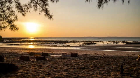 Sunset with ocean and beach and island on the horizon timelapse Stock Footage 50646252