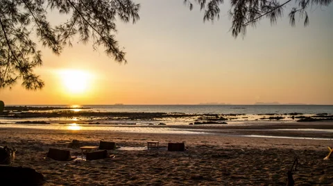 Sunset with ocean and beach and island on the horizon timelapse Video stock 50646940