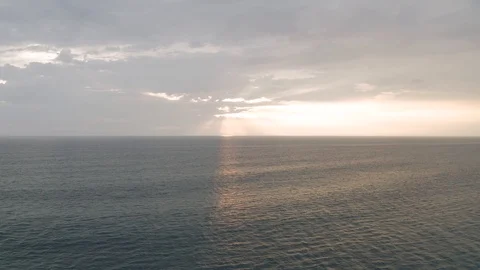 Sunset the Ocean and waves in Batu Balong beach Bali Island 4K Drone flight Stock Footage 119333386