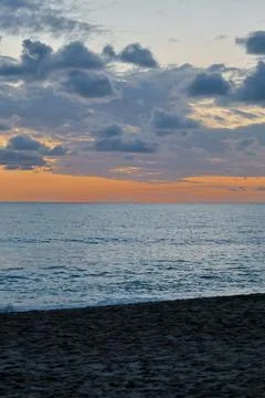 Sunset ocean beach Stock Photos