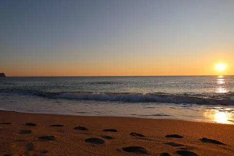 Sunset ocean beach Stock Photos