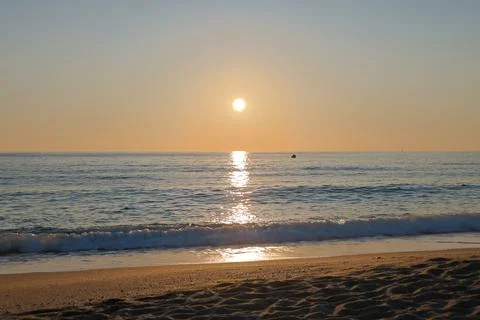 Sunset ocean beach Stock Photos
