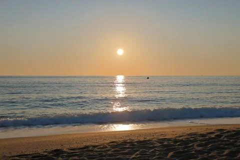 Sunset ocean beach Stock Photos