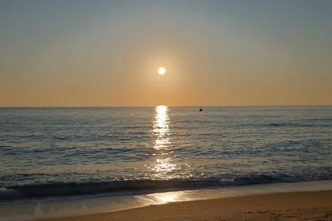 Sunset ocean beach Stock Photos