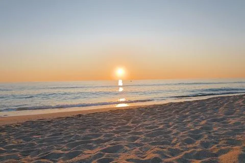 Sunset ocean beach Stock Photos