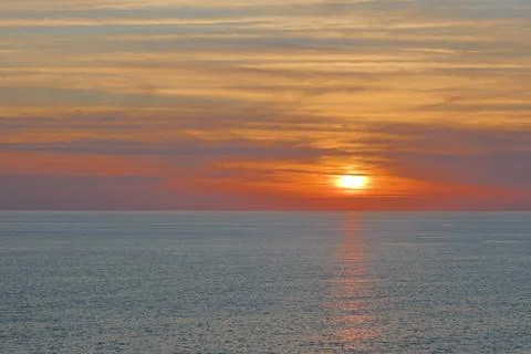 Sunset ocean beach Stock Photos