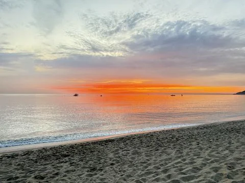 Sunset ocean beach Stock Photos