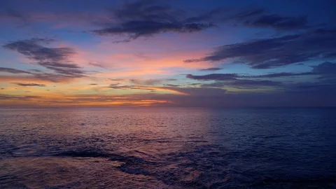 Sunset in ocean beach with red and dark blue sky and big waves on beach Video stock 113273105