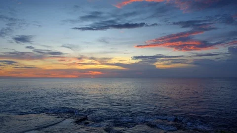 Sunset ocean beach with rock and blue sky 動画素材 113272183