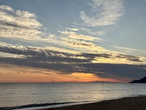 Sunset ocean beach.Ocean sunset clouds Stock Photos