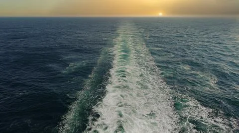 Sunset in the ocean on board a ship Stock Photos
