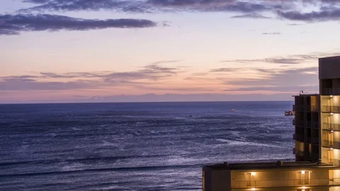 Sunset on the ocean with building timelapse Stock Footage 122295675