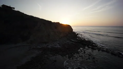 Sunset with ocean cliffs and house Stock Footage 57368733
