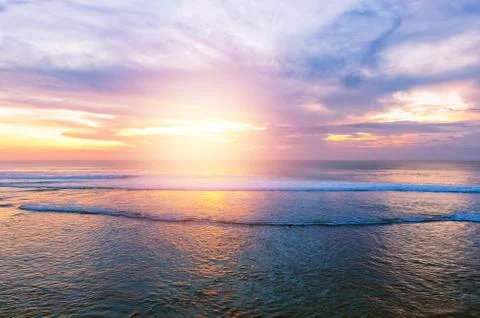 Sunset at the ocean in dark tones Stock Photos