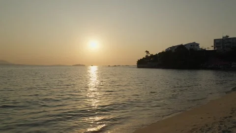 Sunset to ocean horizon shot at beach - 4k Stock Footage 301440718