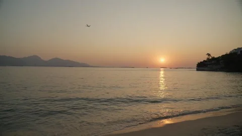 Sunset to ocean horizon shot at beach - 4k Stock Footage 301440720