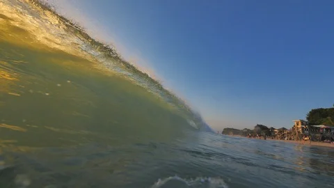 Sunset in the ocean with incoming waves  in half framerate Stock Footage 90005236