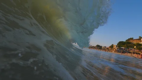 Sunset in the ocean with incoming waves  in half speed framerate Stock Footage 90005294