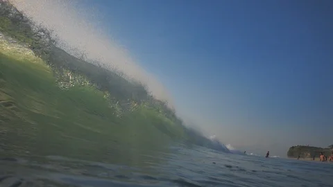 Sunset in the ocean with incoming waves  in slowmotion Stock Footage 90004791