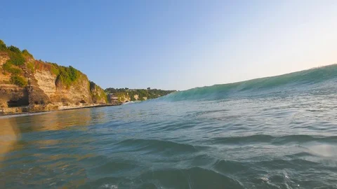 Sunset in the ocean with incoming waves  in slowmotion Stock Footage 90004866