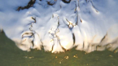 Sunset in the ocean with incoming waves  in slowmotion Stock-Footage 90004999