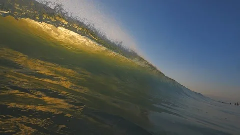 Sunset in the ocean with incoming waves  in slowmotion Stock Footage 90005102