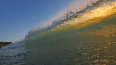 Sunset in the ocean with incoming waves  in slowmotion Video stock 90005701