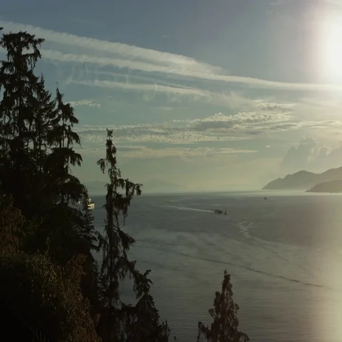 Sunset on the Ocean with mountains Stock Footage 69722344