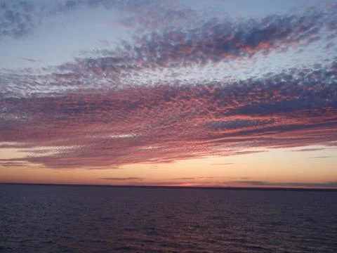 Sunset in ocean Stock Photos