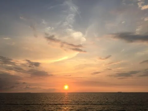 Sunset by the ocean Stock Photos