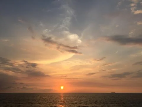 Sunset by the ocean Stock Photos