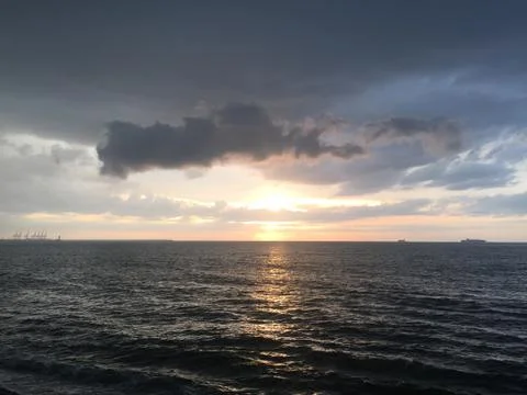 Sunset by the ocean Stock Photos