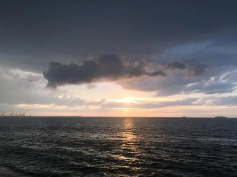 Sunset by the ocean Stock Photos