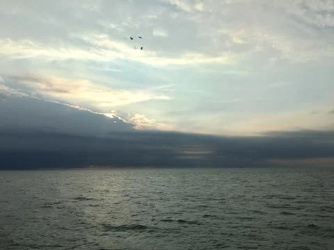 Sunset by the ocean Stock Photos