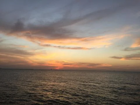 Sunset by the ocean Stock Photos