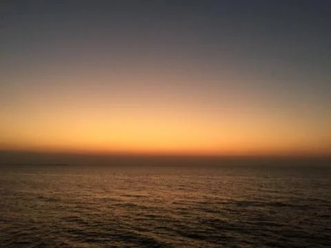 Sunset by the ocean Stock Photos