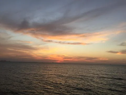 Sunset by the ocean Stock Photos