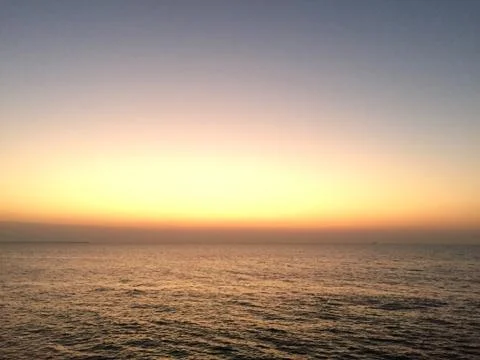 Sunset by the ocean Stock Photos