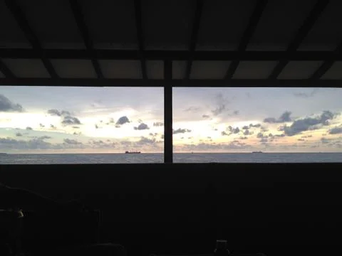 Sunset by the ocean Stock Photos