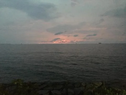 Sunset by the ocean Stock Photos