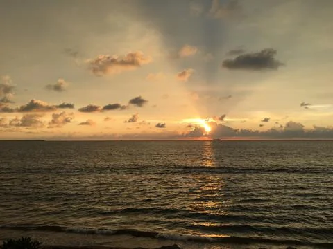 Sunset by the ocean Stock Photos