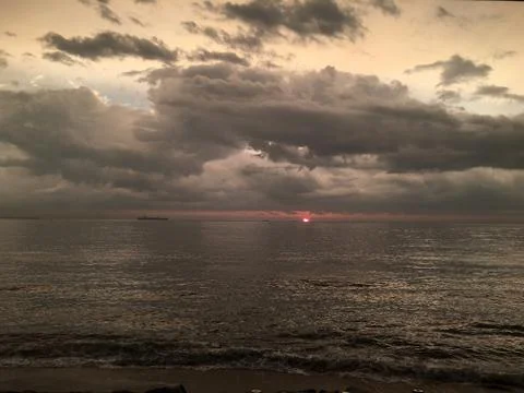 Sunset by the ocean Stock Photos