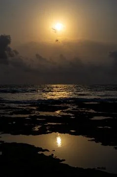 Sunset by the ocean Stock Photos