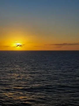 Sunset in the ocean Stock Photos