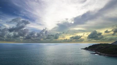 Sunset on the ocean with seashore Stock Photos