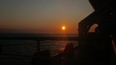 Sunset in ocean from side of ship Stock Footage 254131352