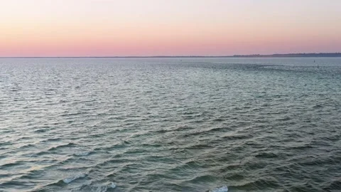 Sunset in the ocean with soft waves Stock Footage 141454621