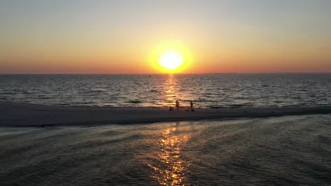 Sunset in the ocean with soft waves Stock Footage 141457974