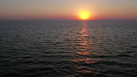 Sunset in the ocean with soft waves Stock Footage 141458131