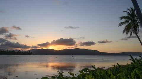 Sunset ocean view mountains at night day Stock Photos